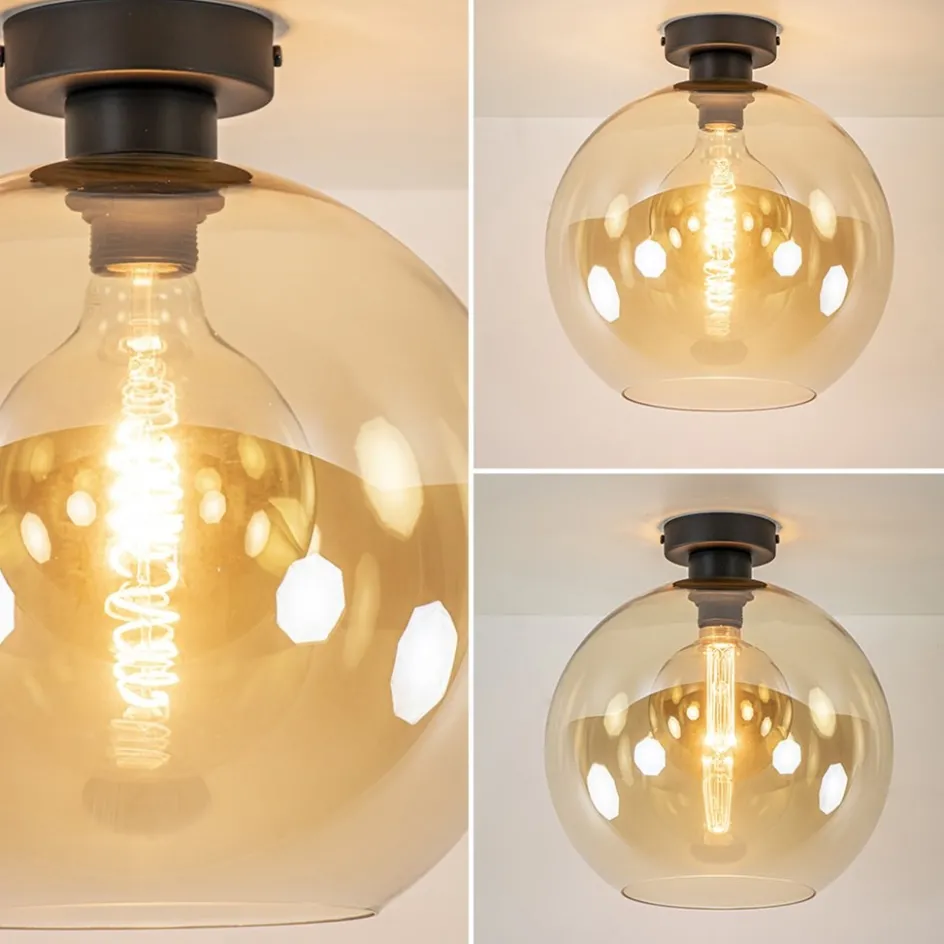 Retro plafondlamp zwart met amber glazen bol>Straluma New